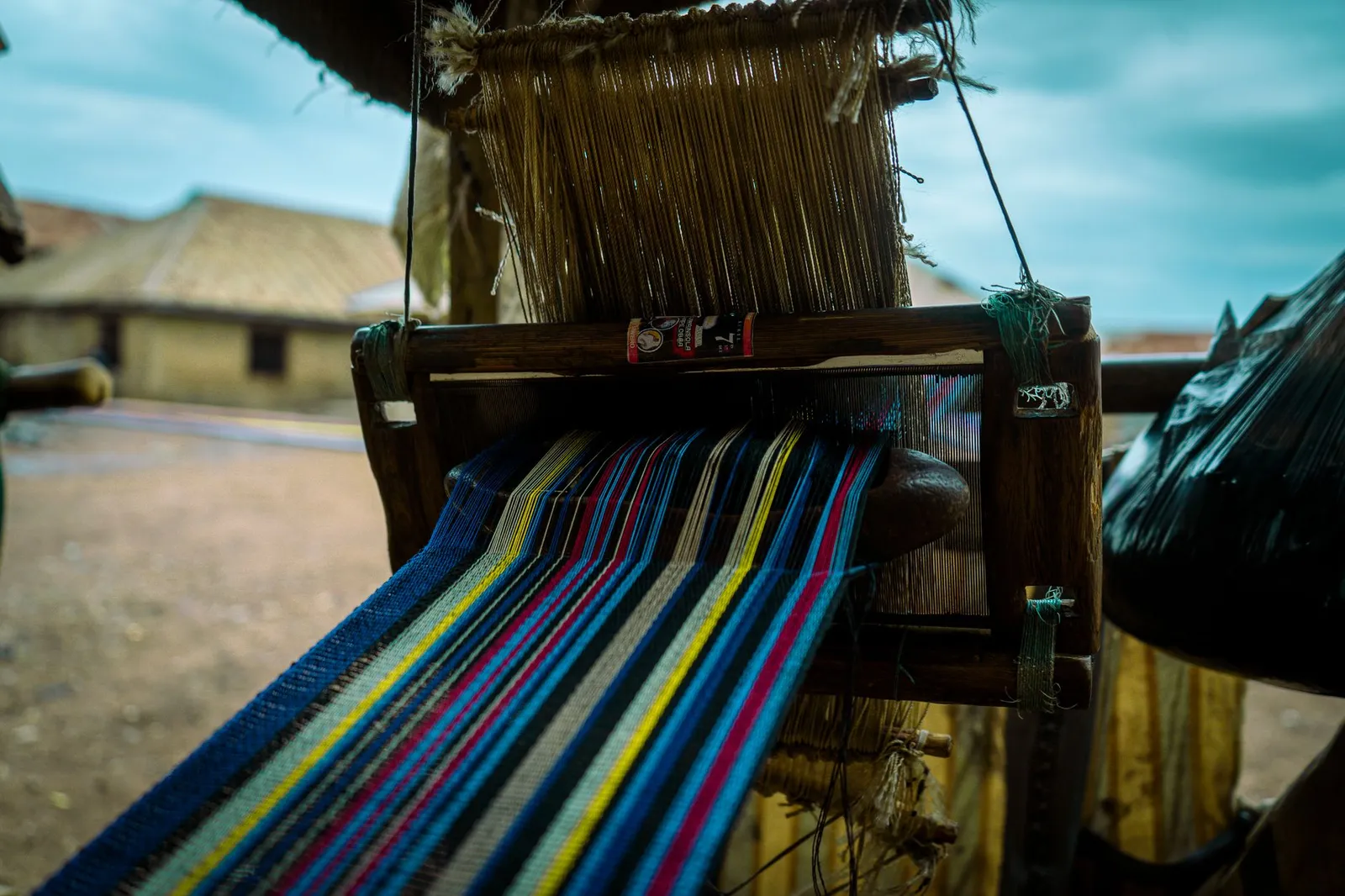 Kenneth Ize — handwoven aso-oke textile craft (illustrative)
