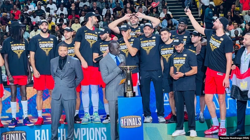 Egypt's Al Ahly receiving the Basketball Africa League championship trophy after the 2023 BAL Final.